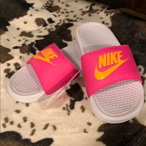 pink and orange nike slides